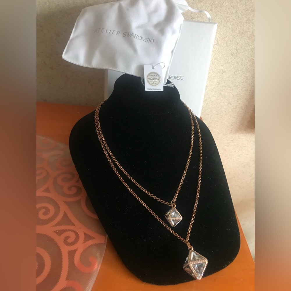 Atelier Swarovski Kaveri pendant necklace w/ crystals in rose gold tone setting.